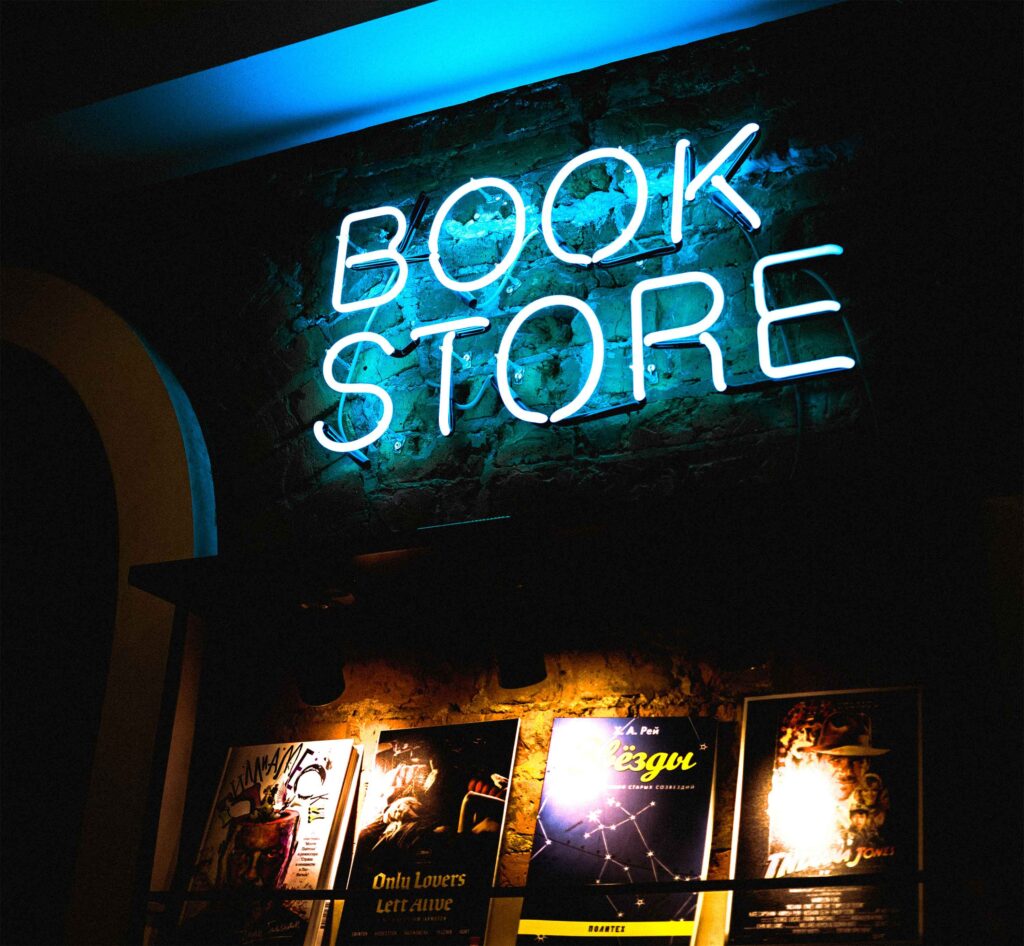This picture has a sign that says book store with books on the bottom having lights. Good for a launch party. 

